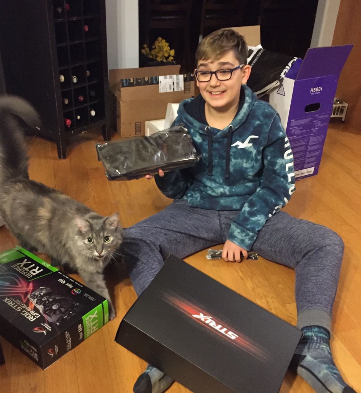 Alex with his first graphics card—and Bella. One of the early computing moments in the founder story.